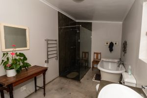 a bathroom with a tub sink and toilet